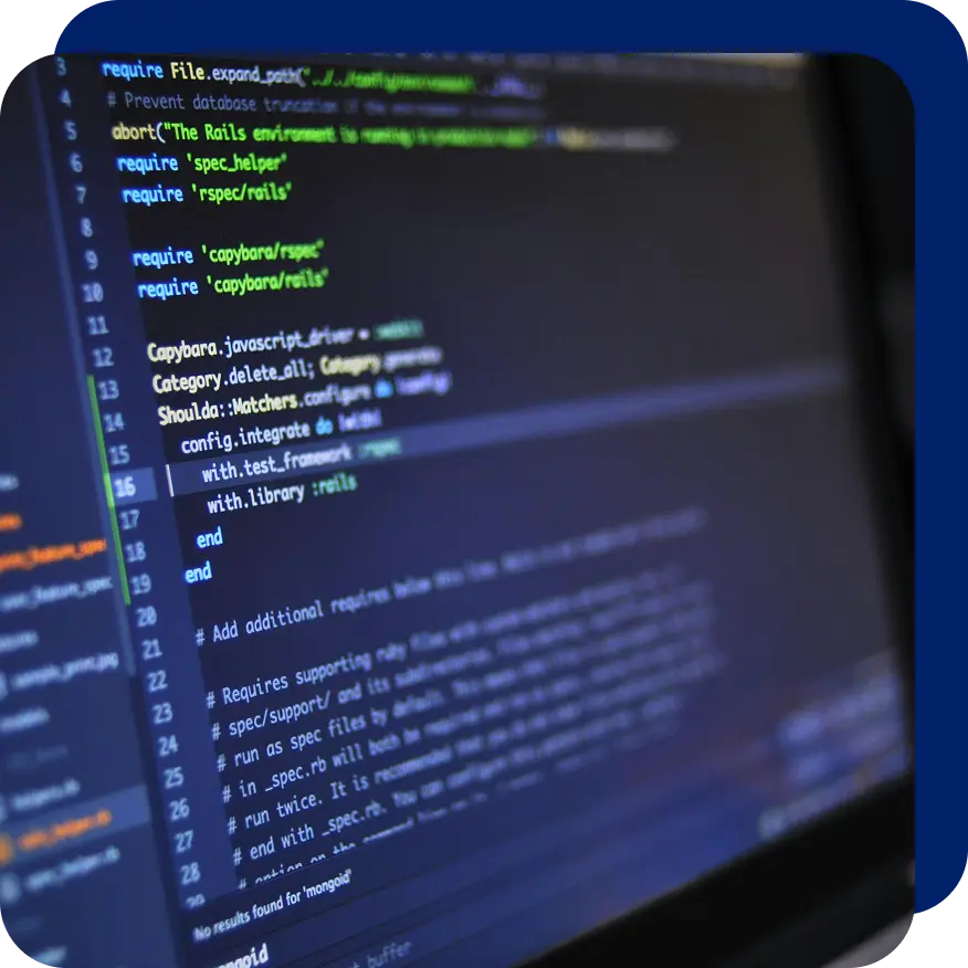 Close-up of a computer screen showing highlighted Ruby code in a dark-themed code editor, representing programming and technology stack development